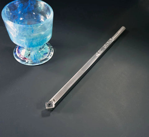 Carbide woodturning tool with square cutter on a 12-inch steel shaft; side view