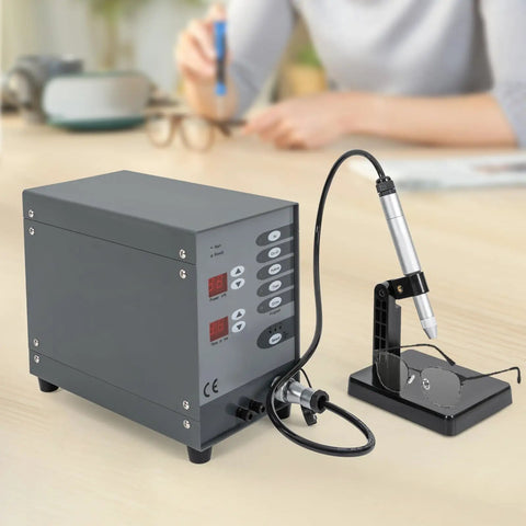 110V Pulse Arc Jewelry Welder Kit for DIY Repairs 100W Spot Weld Machine on a table next to eyeglasses