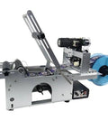 Rugged Semi Automatic Label Applicator For Round Bottles Engineered With Dead On Accuracy And A Built Tough Iron Frame, side view showing applicator.