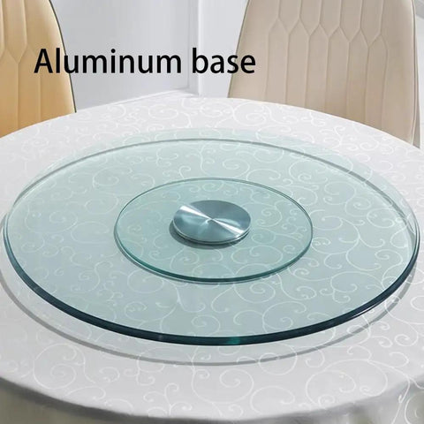 Top Shelf Heavy Duty Tempered Glass Lazy Susan Turntable with aluminum base on a dining table for smooth serving.