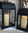 Outdoor Waterproof Flameless Candles With Timers And Remote Control in black lanterns on snowy porch 3 by 7 inch set of 3