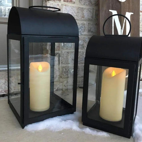Outdoor Waterproof Flameless Candles With Timers And Remote Control in black lanterns on snowy porch 3 by 7 inch set of 3