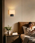 Modern Black Milk Glass Wall Sconces, 1 Pack Hardwired Wall Light Fixtures illuminating a cozy bedroom scene.