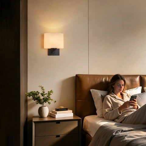 Modern Black Milk Glass Wall Sconces, 1 Pack Hardwired Wall Light Fixtures illuminating a cozy bedroom scene.