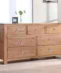 Wooden dresser with 6 Pack Brushed Nickel Ring Drawer Pulls Stainless Steel Cabinet Handles for Kitchen Cabinets and Furniture.