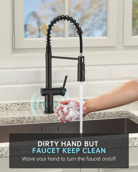 User washing hands under Matte Black Touchless Kitchen Faucet With Pull Down Sprayer, Hands Free Sensor activated, in a modern kitchen.