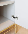 Slick Concealed Cabinet Hinges Featuring Heavy Duty Soft Close Mechanism in brushed nickel on cupboard door.