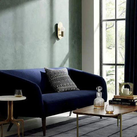 Living room with blue sofa and wall showcasing Two Pack Brushed Gold Oval Wall Sconces Modern Mid Century Vanity Lights