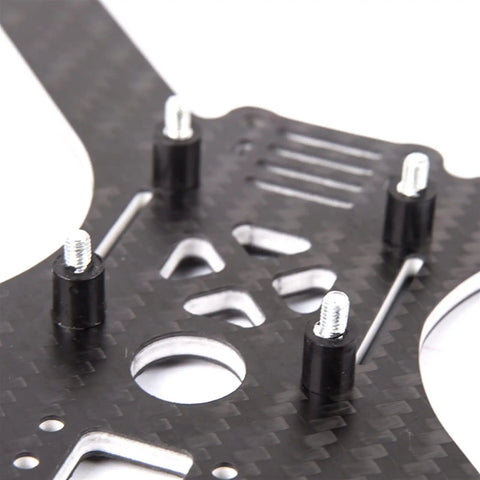 Close-up of 4 Piece M3 Flight Controller Anti Vibration Mount Kit with rubber pillars and studs on carbon fiber plate