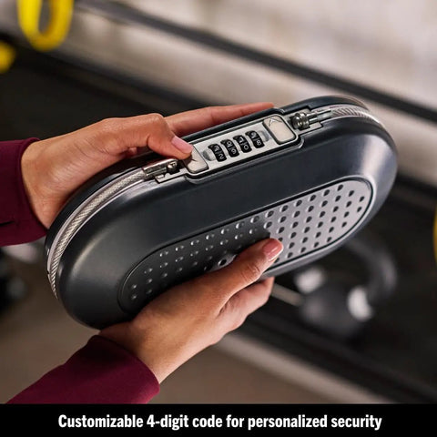 Person holding Portable Travel Lock Box With Four-Digit Combo, Small Personal Safe For Phones, Passports, Cash And Cards, Secure Your Gear On The Go, Cable Ready And Easy To Use, Gunmetal Grey 5900D showing four-digit combo lock