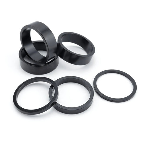 6 Pack 1 1/8 Inch Aluminum Bike Headset Spacers Set Anodized Black for MTBs and BMX, showing different spacer sizes.