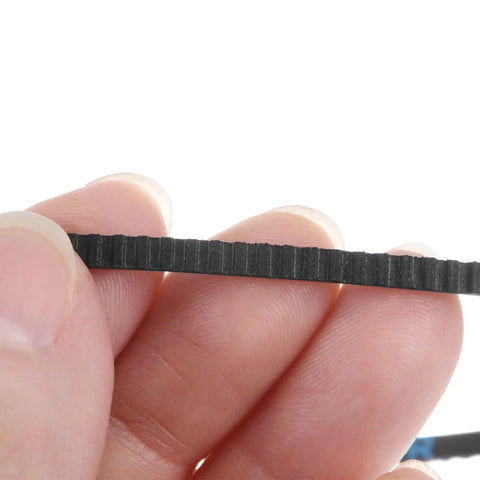 184 Tooth Timing Belt With Closed Loop Pulley Gear Cogged Rubber Drive Belt 14.7 Inch Length 0.125 Inch Wide Fiberglass Cord Reinforced close-up held by fingers