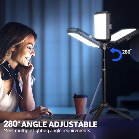 User smiling at laptop with Two Pack 8 Inch Dope LED Video Lights With 29 Inch Adjustable Tripods, lighting at 280 degrees.