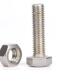 Stainless steel bolt and nut against white background, showcasing threading details.