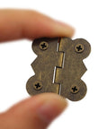 Old School Antique Butterfly Style Cabinet Hinge 30x25mm Iron Bronze Finish held between fingers, vintage hardware, 30 pack with screws