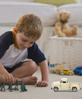 Child playing with small off road pickup truck model toy figure for kids and collectors, realistic 4.92 inch mini car on floor