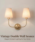 MIKLESLUC Vintage Double Sconce Large Antique 2-Lights Sconces with Flared Funnel Linen Beige Fabric Shade Hardwired Double Wall Sconce E26 Base mounted on a wall.