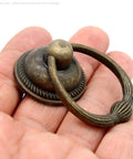 Set Of 6 Vintage Antique Brass Drop Ring Pulls For Drawers With Single Mounting Hole Large Ring Size 1.4-Inch And Pull Height 2.1-Inch Retro Style Drawer Handles - close-up view showing detailed design and finish on hand