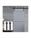 No Fuss Heavy Duty Barn Door Hardware Kit 18 Foot Single Track Sliding System with grey door and matte black frame.
