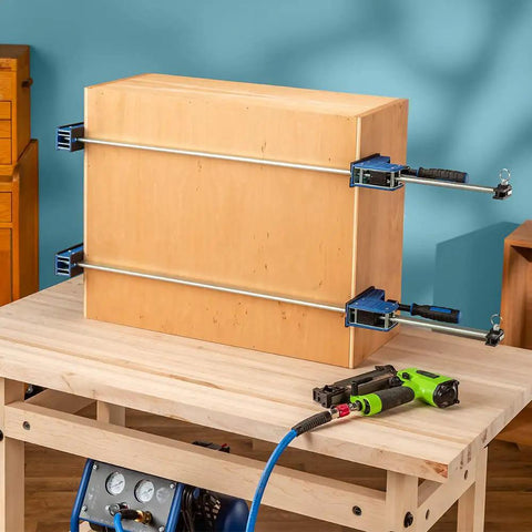Beefy 24-Inch Parallel Bar Clamps For Woodworking, Adjustable Heavy Duty Clamps holding a wooden box on a workbench