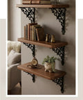 Slick Vintage Black Shelf Brackets Rock Solid Cast Iron L Brackets With Timeless European Scroll Detail supporting wooden shelves with books.