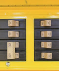 Close-up of thermal breakers in a Pro Grade Job Site Power Distribution Workhorse with durable yellow exterior.