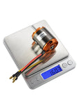 D3548 790KV Brushless RC Motor For Drones And RC Planes, 35x48mm on weighing scale, showing 160.3g, with wires attached