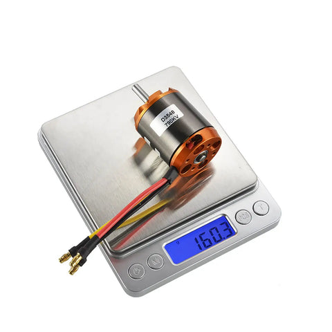 D3548 790KV Brushless RC Motor For Drones And RC Planes, 35x48mm on weighing scale, showing 160.3g, with wires attached