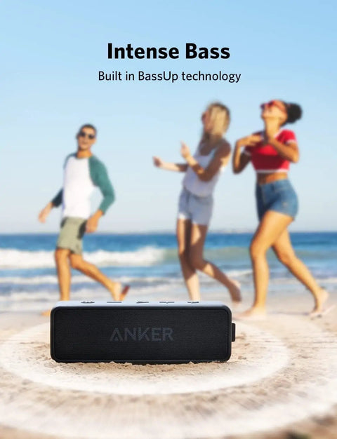 Beefy Bass Portable Bluetooth Speaker With Crisp Stereo Sound, IPX7 Waterproof, 24 Hour Playtime on beach with people dancing
