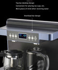 Close-up of button controls on a vertical hot and cold water dispenser with dual outlets and a desktop bar design.