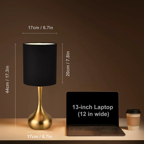 Modern Table Lamp With Brass Droplet Base And Black Linen Drum Shade next to 13-inch laptop size comparison