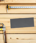 21 Piece Grit Wet Dry Emery Sanding Sheets For Auto Repair And Furniture Restoration on wood surface with tools.