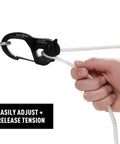 Hand adjusting rope with CamJam XT Aluminum Rope Tightener Large With Carabiner Clip for quick tie downs.