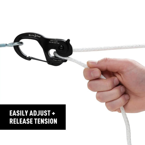 Hand adjusting rope with CamJam XT Aluminum Rope Tightener Large With Carabiner Clip for quick tie downs.