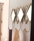 Dang Solid Wall Mount Coat Hook Featuring Heavy Duty Wrought Iron Craft With A Slick Rustic Copper And Gold Finish, multi hook organizer mounted on wall displaying ties and scarves.