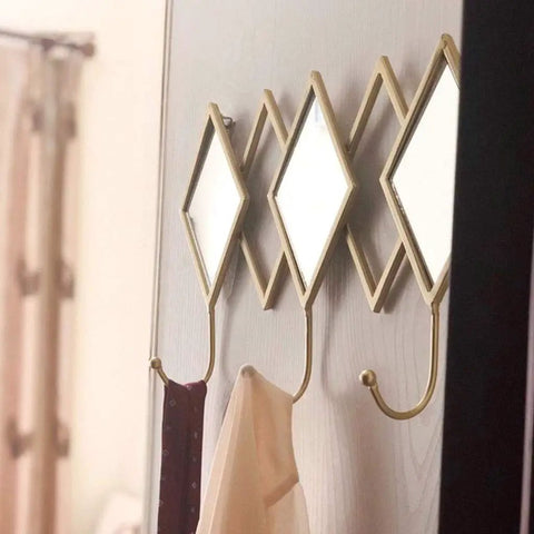 Dang Solid Wall Mount Coat Hook Featuring Heavy Duty Wrought Iron Craft With A Slick Rustic Copper And Gold Finish, multi hook organizer mounted on wall displaying ties and scarves.