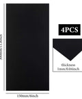 Front view: four black anodized aluminum sheets, 6 x 12 in, 1 mm thick, for laser engraving.