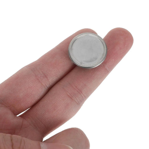 10 Pack Stainless Steel Round Knockout Seal Caps For Electrical Breaker Panels held in hand, showcasing a heavy duty weatherproof plug.