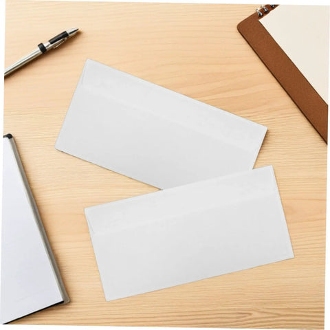 Two white envelopes on a desk, part of a White 100 Pack Self Seal Envelopes With Peel And Seal Privacy Protection For Letter Size Mail