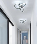 Lit Modern Ceiling Light With 6500K Cool White LED Metal Curved Design Ceiling Fixture Sleek Chrome Finish in hallway view