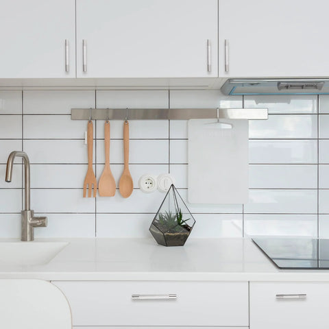Modern kitchen with white cabinets and 10 pack 5 inch center to center brushed satin nickel knurled cabinet handles installed, sleek design