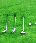 One To Twelve Scale Mini Golf Set For Dollhouse With Alloy Golf Clubs And Balls Realistic Golfing Accessories For Enthusiasts And Collectors Totally Dope Detail For Colorful Dollhouse Decor And Scenic Play on green grass