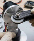 Top Shelf M20 Nylon Flat Washers, White Plastic Insulating Spacers for Bolts and Screws being installed on machinery.
