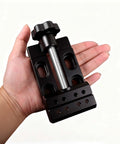 Knockout Mini Bench Clamp With Hella Grippy Superior Aluminum Alloy Vise held in hand, featuring compact size and detailed design.