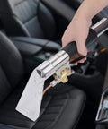 Auto Detail Wand Hand Tool For Cleaning And Detailing Lightweight Durable Water Resistant Dust Absorbing Extractor shown on car seat