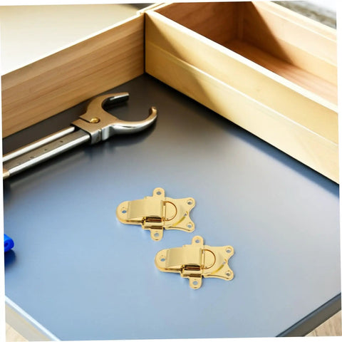 Cool Vintage Duckbill Hasp Latches For Secure Wooden Boxes And Storage Lockers on a workspace with tools.