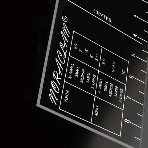 Close-up of Pro T Shirt Ruler Guide showing built-in size chart for easy accurate alignment of vinyl and sublimation designs on shirts.