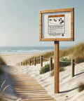 Wooden warning sign on beach boardwalk indicating Ultra Beach Umbrella Base For 7.5 Ft Umbrellas With 75 Lb Bottom Weight Heavy Duty Stability ASTM F3681 24 Compliant.