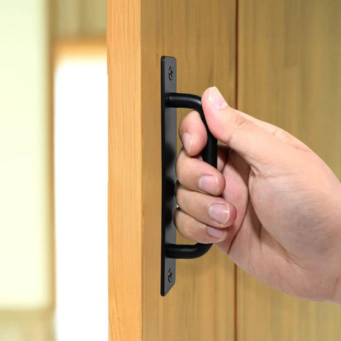 Hand pulling 5 Inch Black Barn Door Handle on cabinet