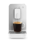 Real Deal Fully Automatic Espresso Machine With Durable Steel Burr Grinder For Bold Whole Bean Coffee And No Fuss Brewing In Sleek Matte White Kitchen Essentials with a cup of coffee.